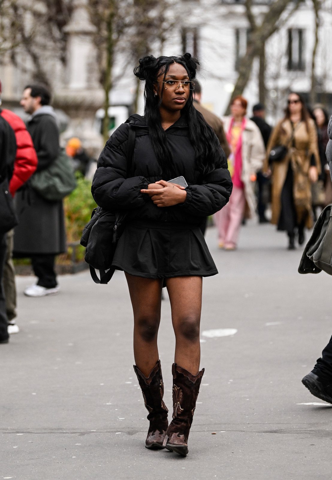 Urban Edge: Dark Brown Cowboy Boots with Pleated Skirt and Puffer Jacket — Cowboy Boots with Skirt Outfits