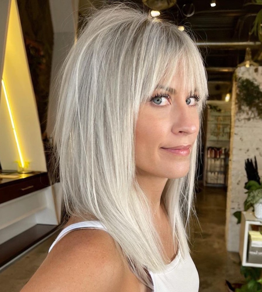 Ash Blonde Layers With Wispy Bangs — Medium Hair with Bangs