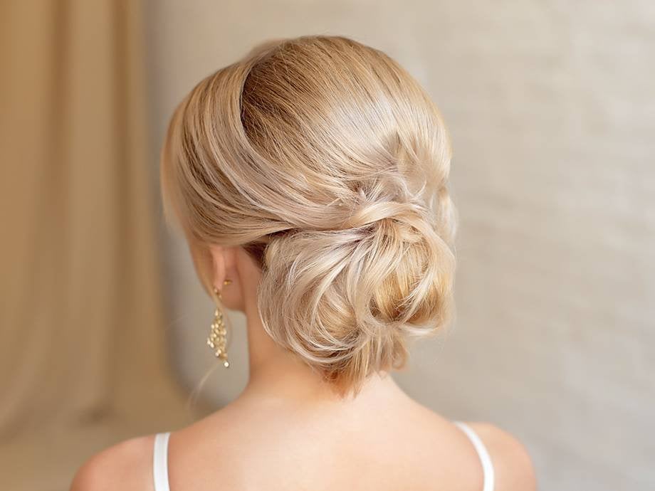 Loose Light Blonde Chignon With Wispy Strands Loose Light Blonde Chignon With Wispy Strands
