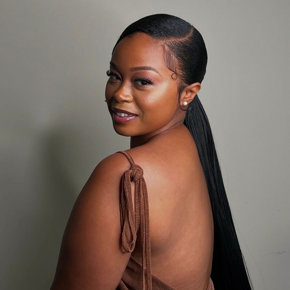 Mid-Back Black Ponytail With Polished Baby Hairs — Sleek Low Ponytail