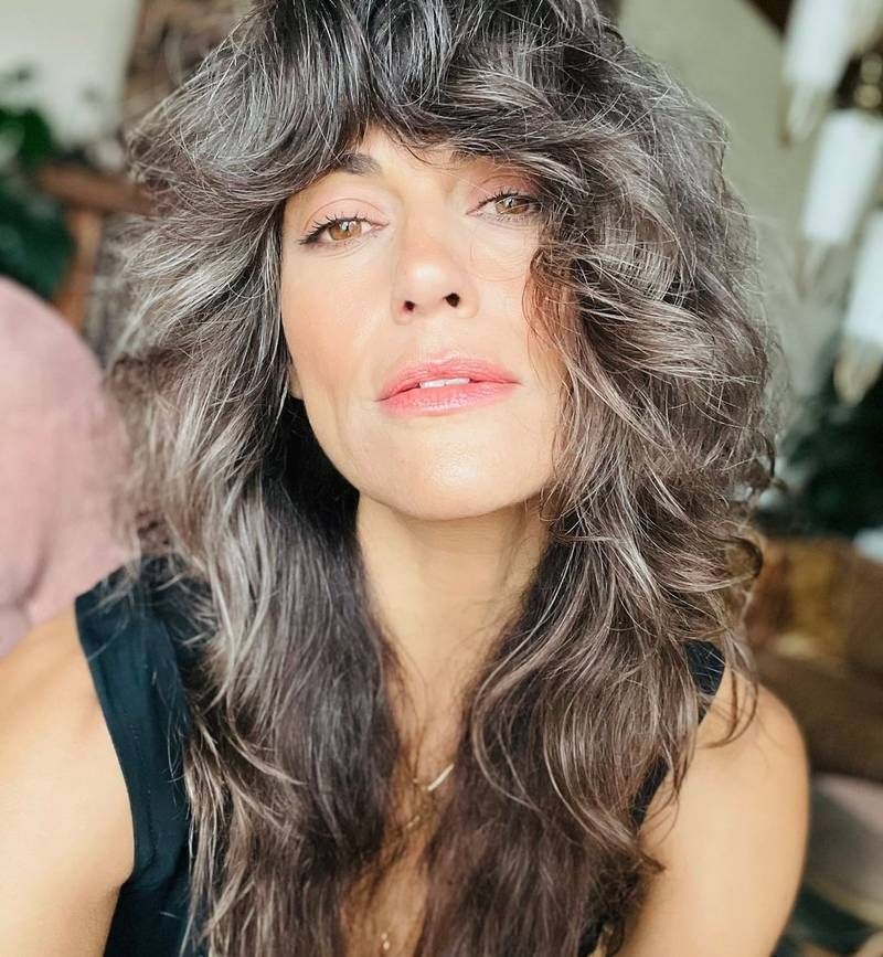 Voluminous Wavy Coily Mid-Back Voluminous Wavy Coily Mid-Back — 70s Hairstyles