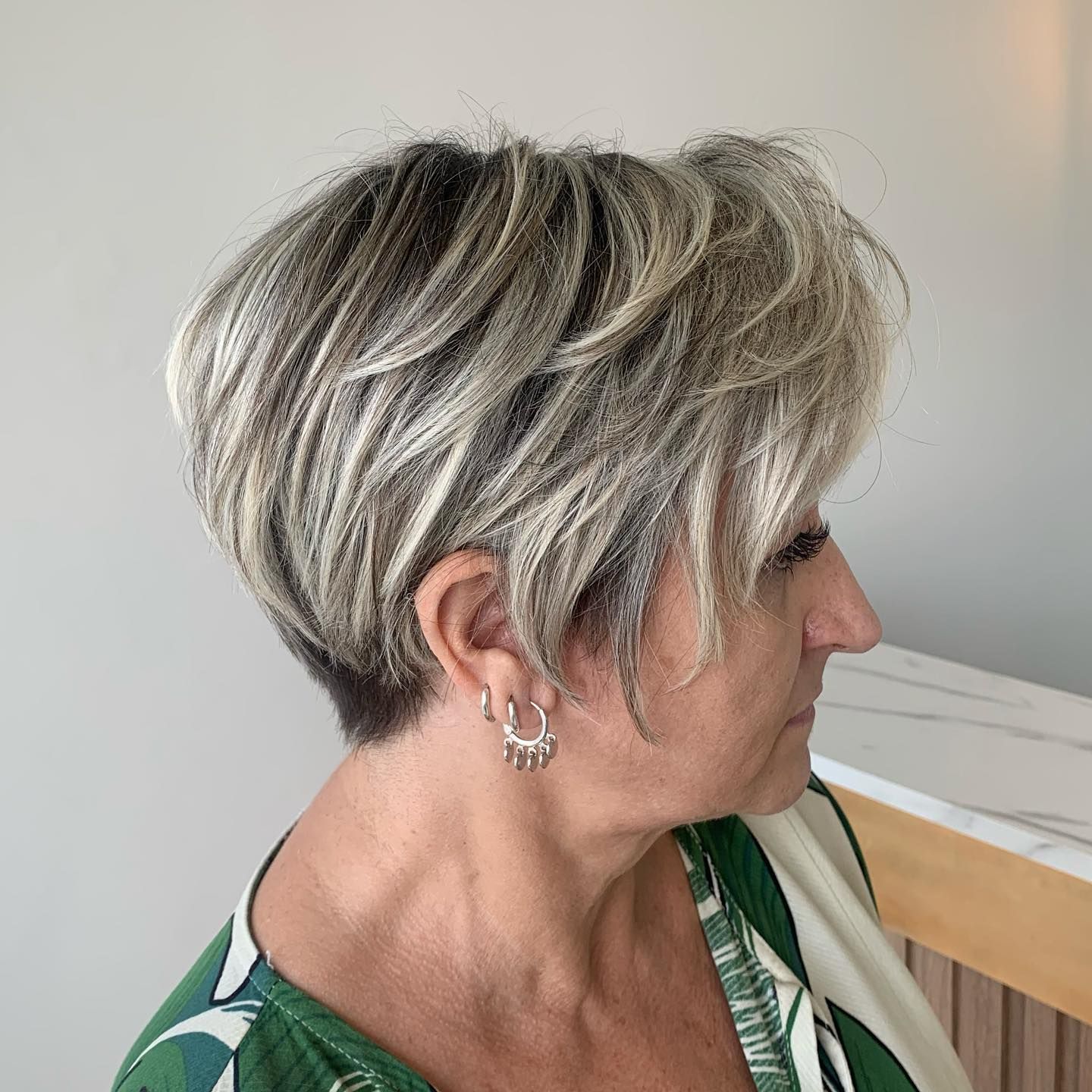 Ear-Length Ash Blonde Pixie With Silver Highlights Ear-Length Ash Blonde Pixie With Silver Highlights — Highlights Over 60