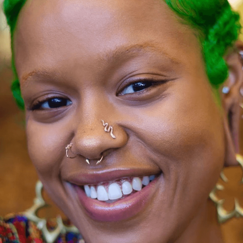 Vibrant Green Hair with Snake Septum Piercing Vibrant Green Hair with Snake Septum Piercing — Septum Piercing Ideas