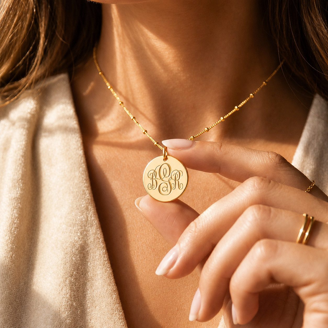 Gold Monogram Disc Necklace on Textured Jacket Gold Monogram Disc Necklace on Textured Jacket — Initial Necklaces