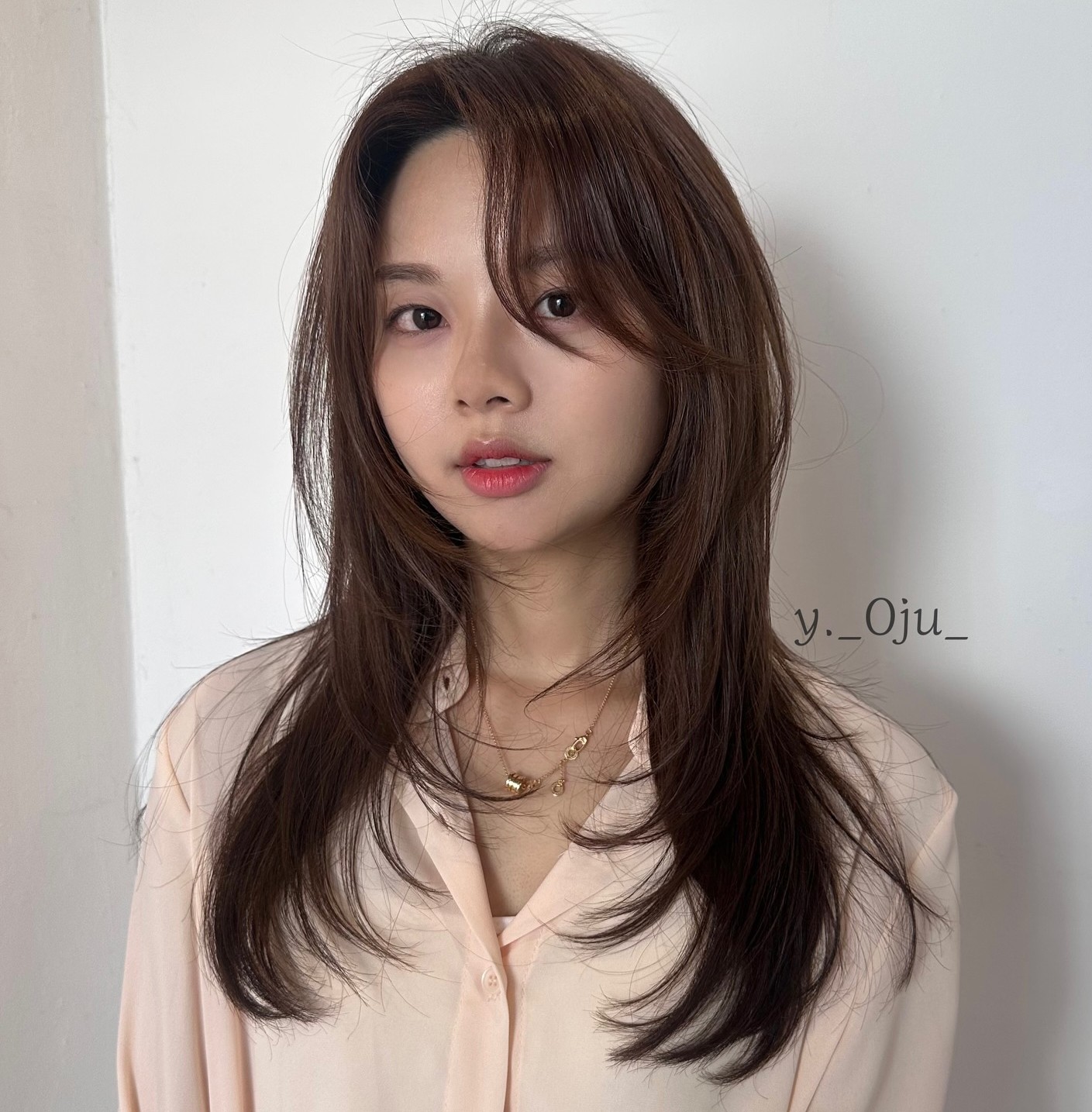 Layered Brown Hair with Pink Shirt and Gold Necklace Layered Brown Hair with Pink Shirt and Gold Necklace — Curtain Bangs