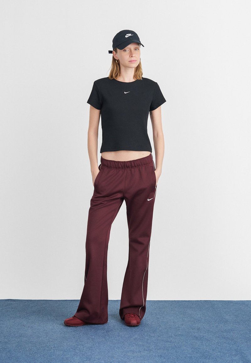Streetwear Style: Nike Crop Top and Flared Track Pants — Nike Outfits