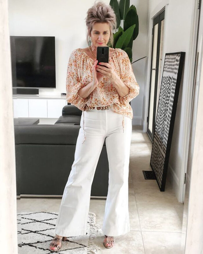 Crisp White Flares with a Floral Blouse — Flare Jeans Outfits