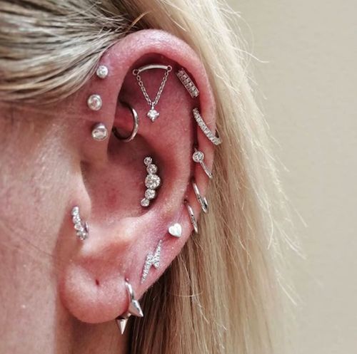 Edgy Silver Piercings Including Chain-Linked Cartilage and Spikes Edgy Silver Piercings Including Chain-Linked Cartilage and Spikes — Ear Piercing Ideas