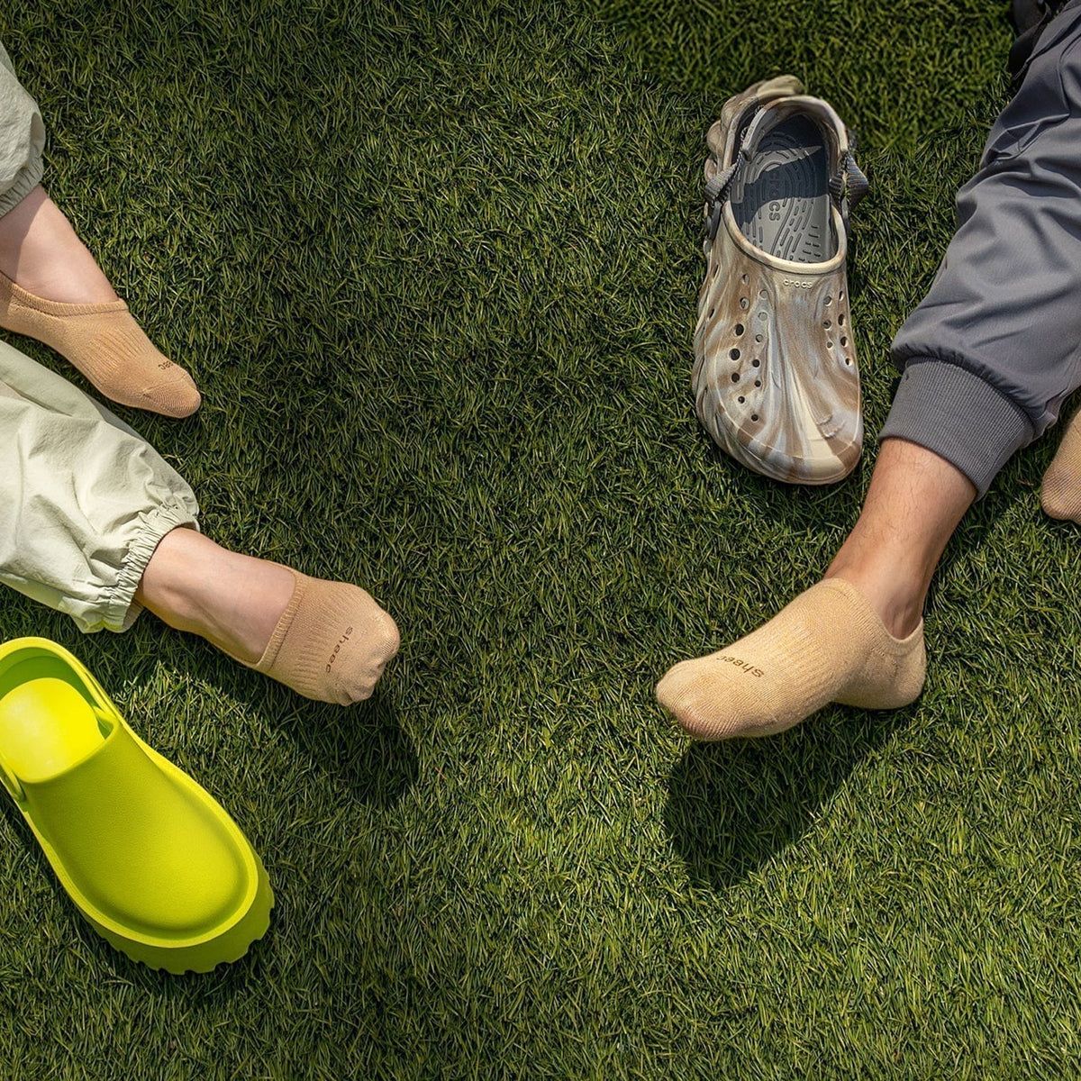 Beige Marbled Clogs with Tan Socks and Loose Pants — Crocs Outfits