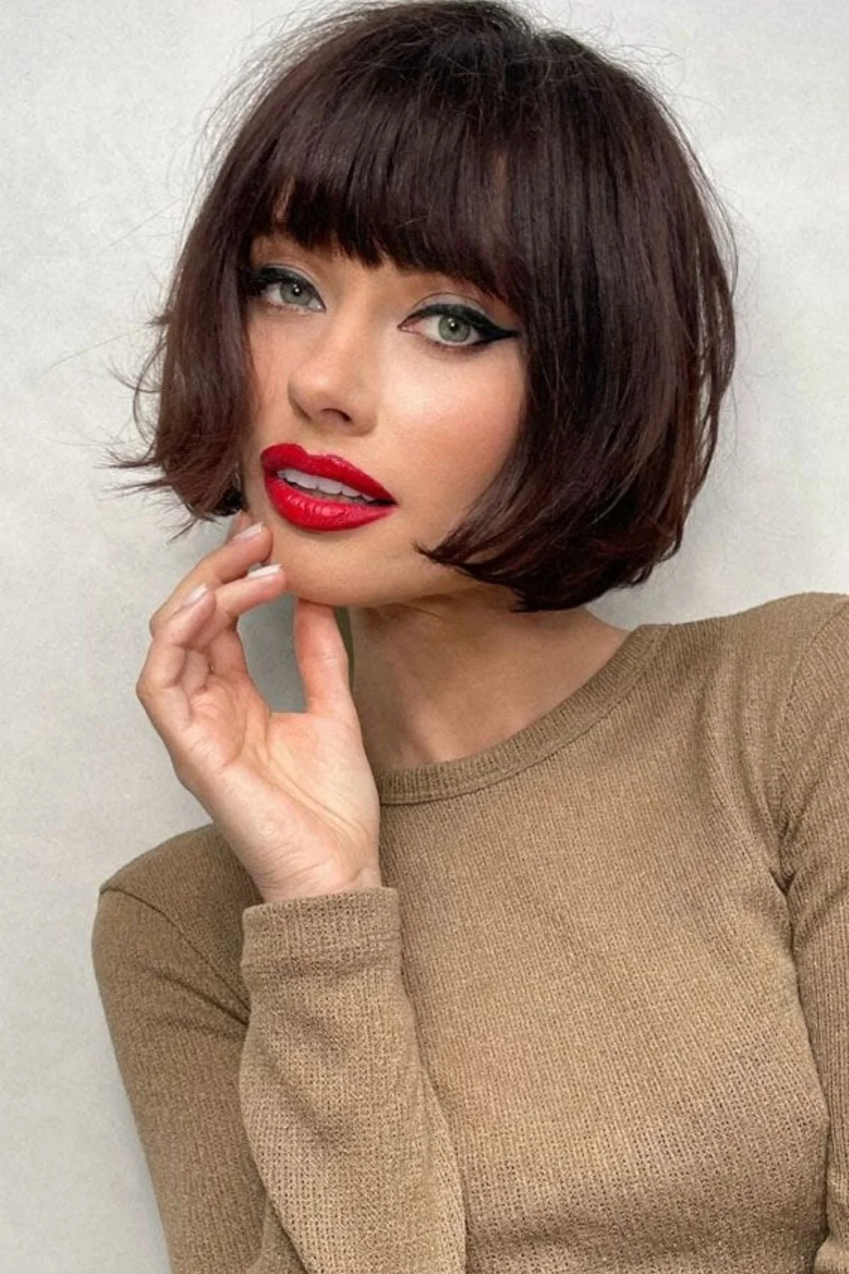 Bob Haircut with French Bangs and Bold Red Lipstick Bob Haircut with French Bangs and Bold Red Lipstick