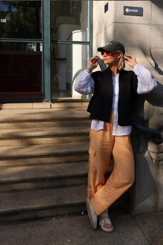 Vest Layered Over Blouse and Striped Trousers Vest Layered Over Blouse and Striped Trousers — Amsterdam Outfits