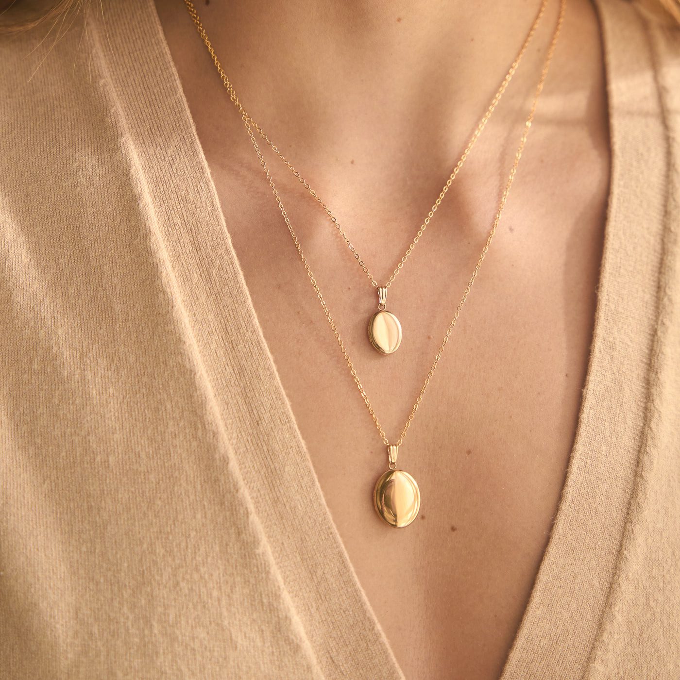Double Oval Locket Layering on Beige Knit — Locket Necklaces