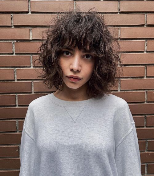 Dense Collarbone Shag With Curly Bangs — Curly Shag