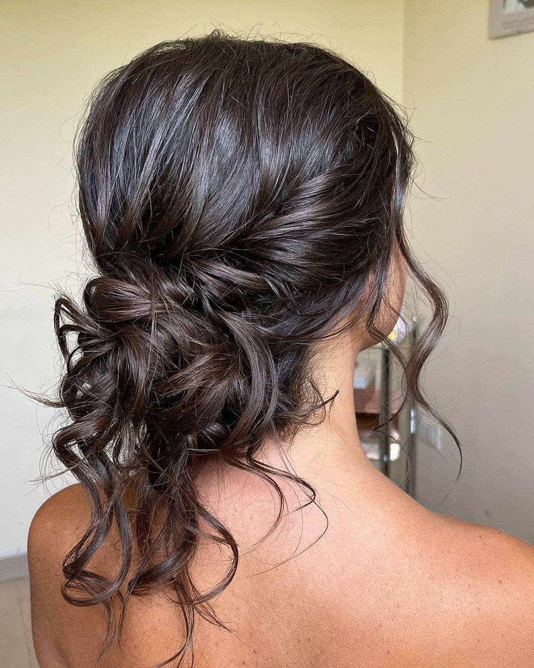 Dark Brown Wavy Messy Low Bun With Wet-Look Finish