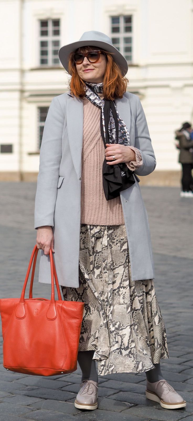 Light Blue Coat with Snake Print Skirt and Red Tote — Prague Outfits