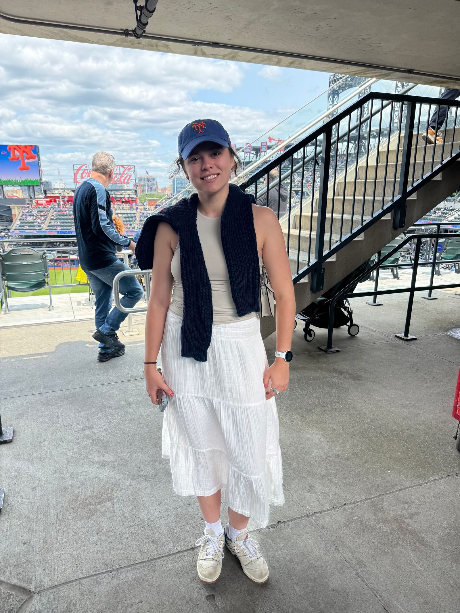 Tiered Midi Skirt with Draped Sweater and Baseball Cap — Baseball Game Outfits