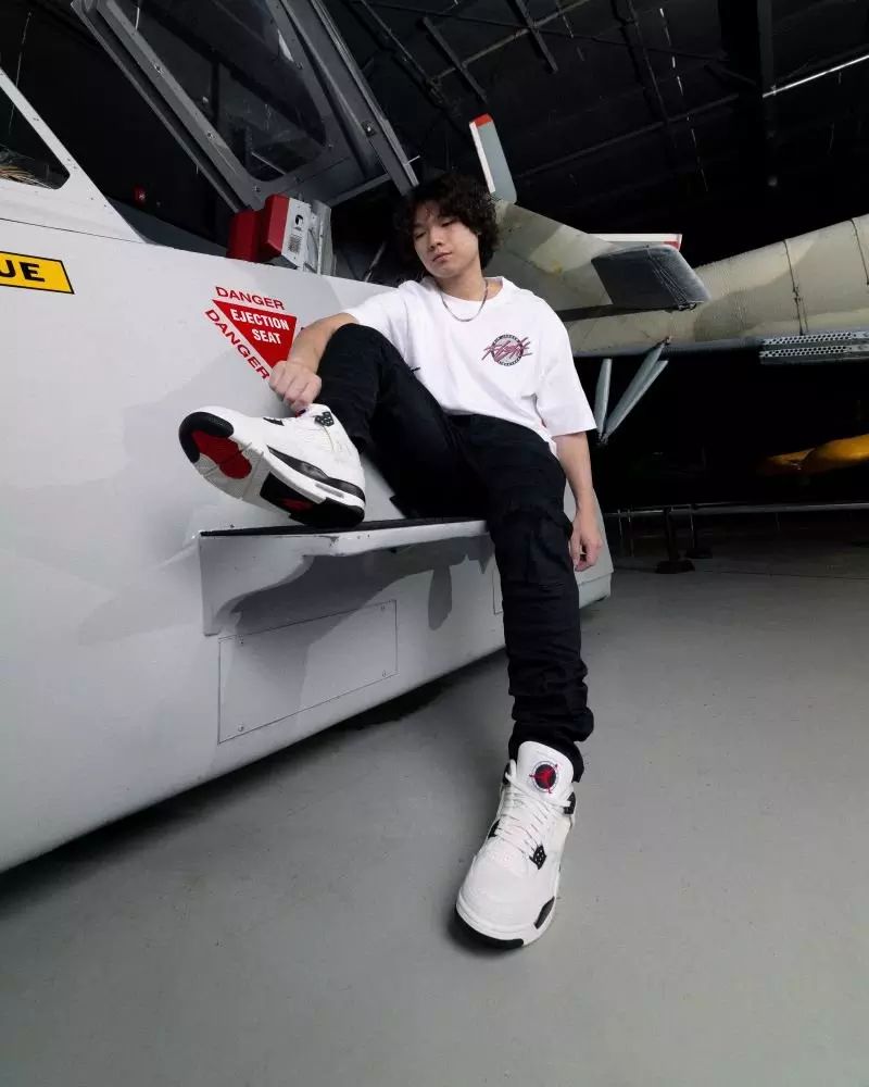 Classic Streetwear: White and Black Jordan 4s with Red Accents Classic Streetwear: White and Black Jordan 4s with Red Accents — Jordan 4 Outfits