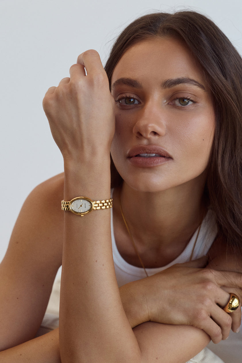 Gold Oval Watch with Delicate Gold Jewelry — Gold Watches for Women