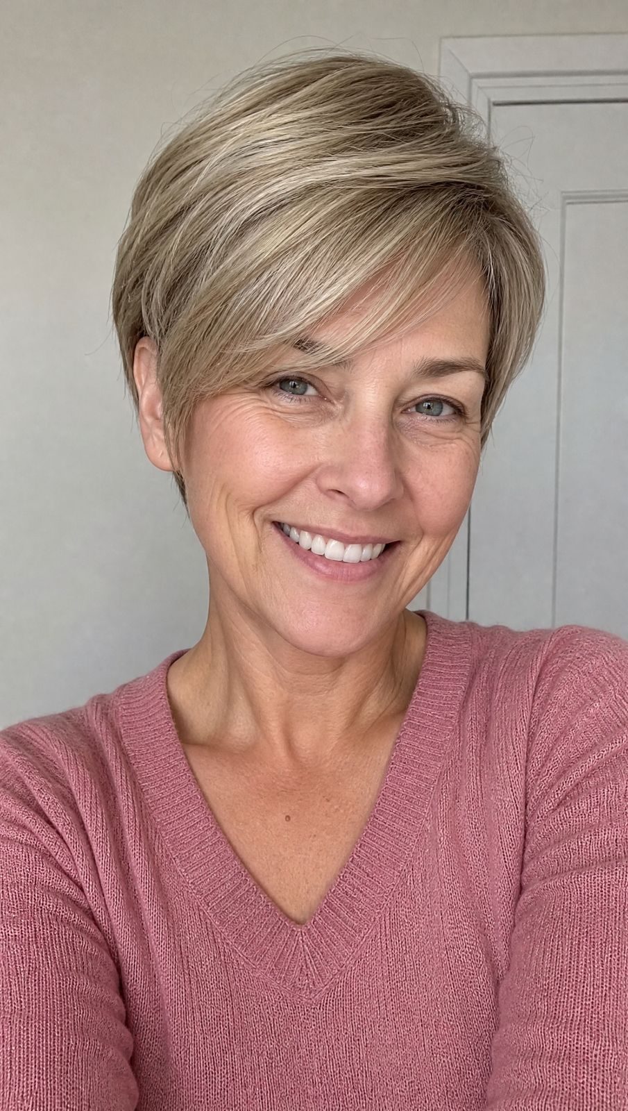Ash Blonde Pixie With Side-Swept Bangs Ash Blonde Pixie With Side-Swept Bangs — Haircuts for Women Over 40