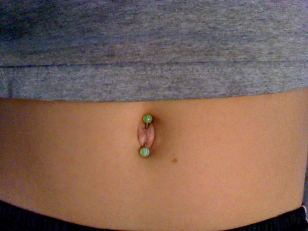 Bohemian Beach Vibes: Dreamcatcher Charm Belly Piercing with Bikini — Belly Button Piercing Ideas