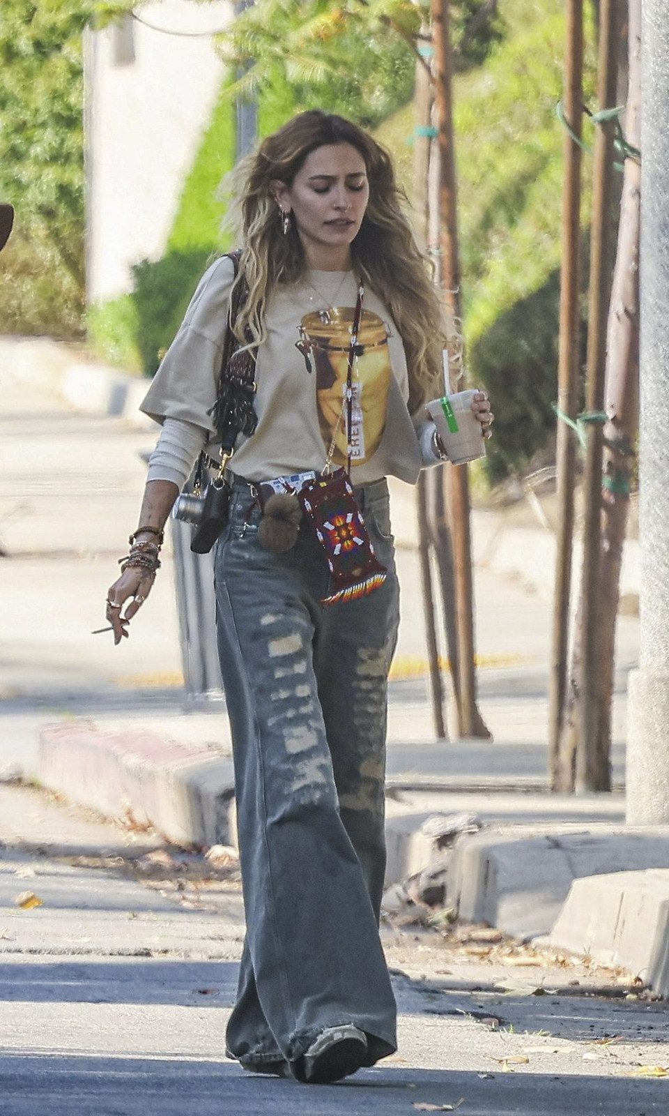 Distressed Wide-Leg Jeans with Layered Graphic Tees Distressed Wide-Leg Jeans with Layered Graphic Tees — Los Angeles Outfits
