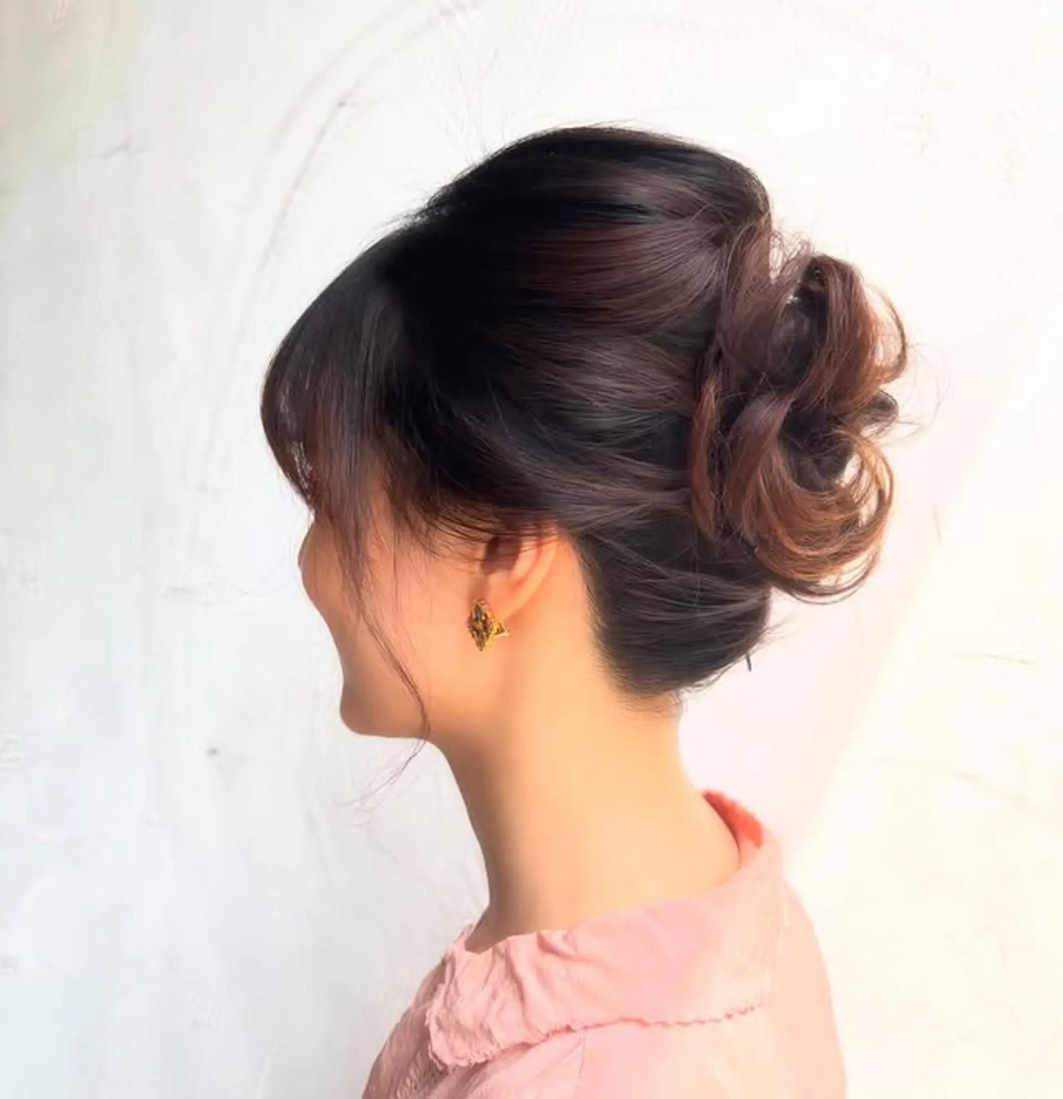 Voluminous Dark Brown Bun with Curls — Low Bun with Bangs