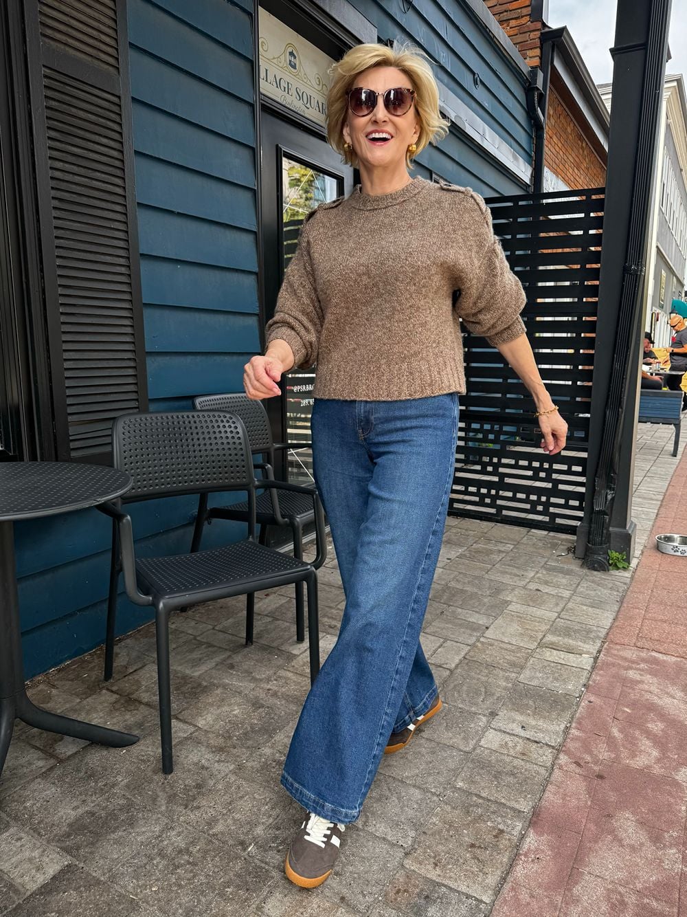 Medium Wash Wide Leg Jeans with a Cropped Knit Sweater and Sneakers