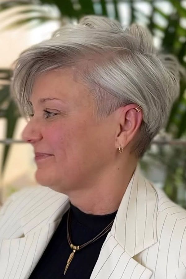 Silver Wavy Pixie with Side-Swept Bangs — Undercut Hairstyles for Women