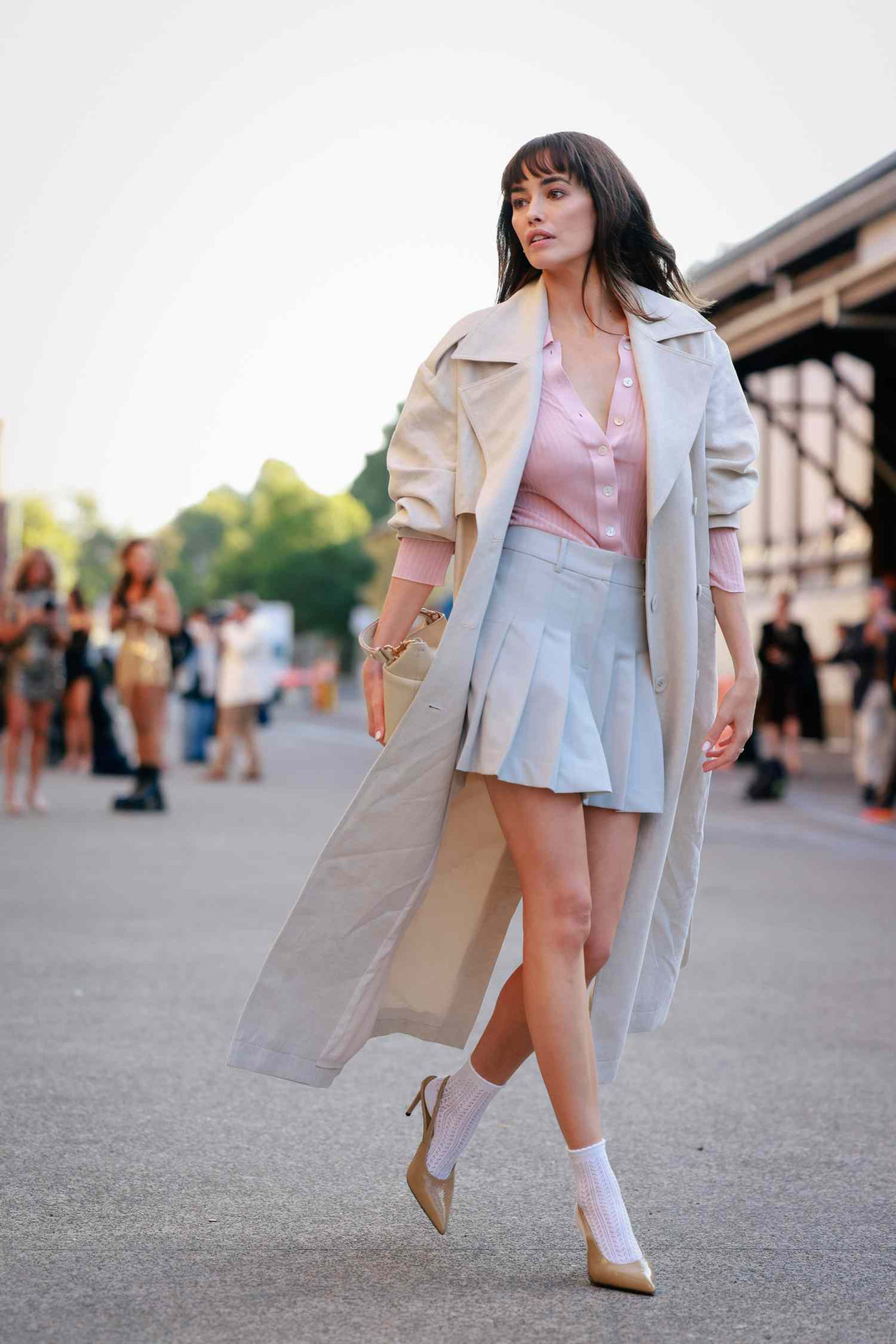 Pleated Mini Dress Layered Under an Oversized Trench Coat Pleated Mini Dress Layered Under an Oversized Trench Coat — Light Feminine Outfits