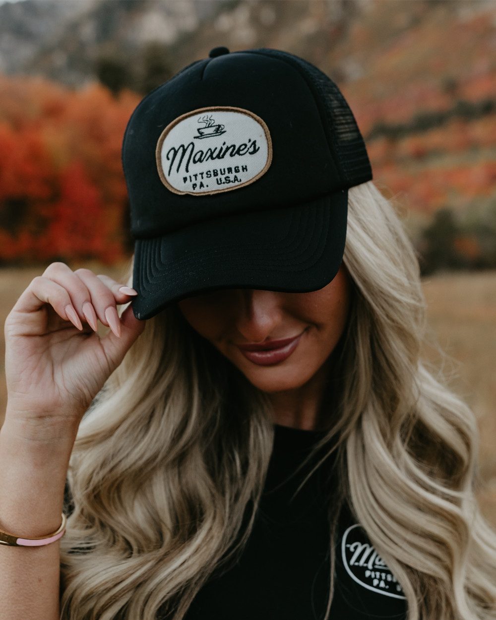Logo Trucker Hat with a Simple Black Tee Logo Trucker Hat with a Simple Black Tee — Trucker Hat Outfits