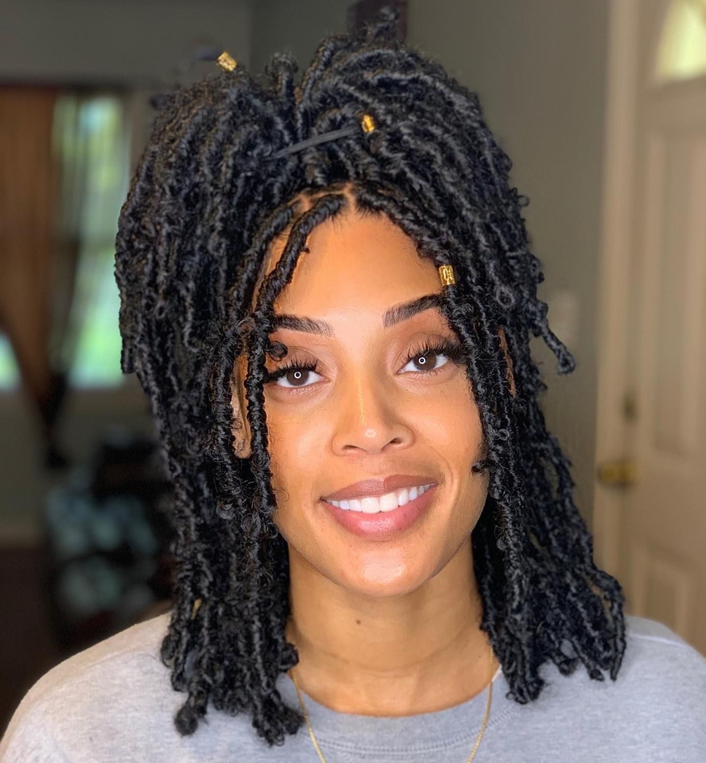 Black Butterfly Locs With Gold Beads Black Butterfly Locs With Gold Beads — Loc Half Up Half Down