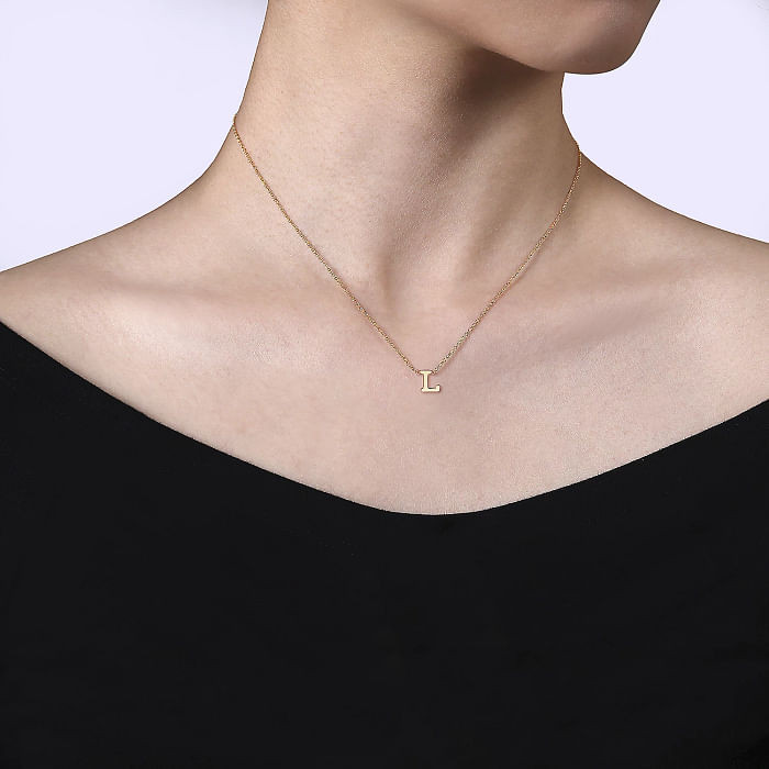Tiny Gold Initial 'L' on Off-the-Shoulder Top Tiny Gold Initial 'L' on Off-the-Shoulder Top — Initial Necklaces