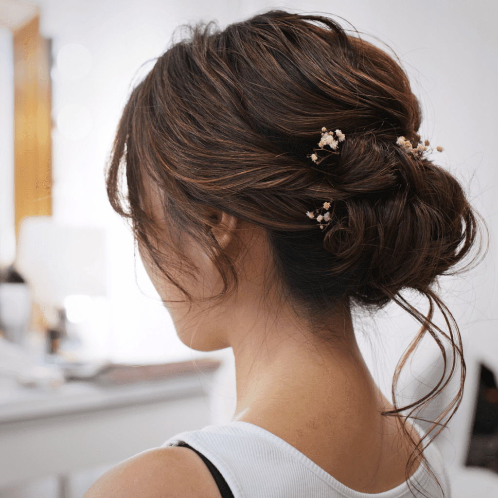 Textured Low Bun with Dried Flowers — Engagement Photo Hairstyles
