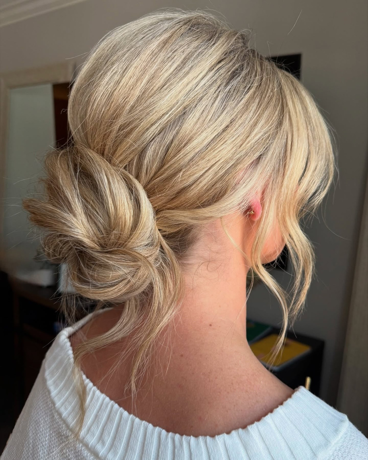 Textured Ash Blonde Low Bun Textured Ash Blonde Low Bun — Low Bun with Curtain Bangs