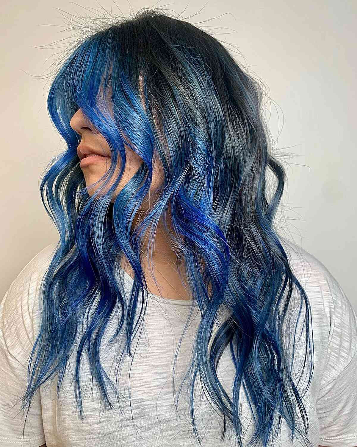 Blue Balayage on Wavy Mid-Back Hair — Pastel Blue Hair