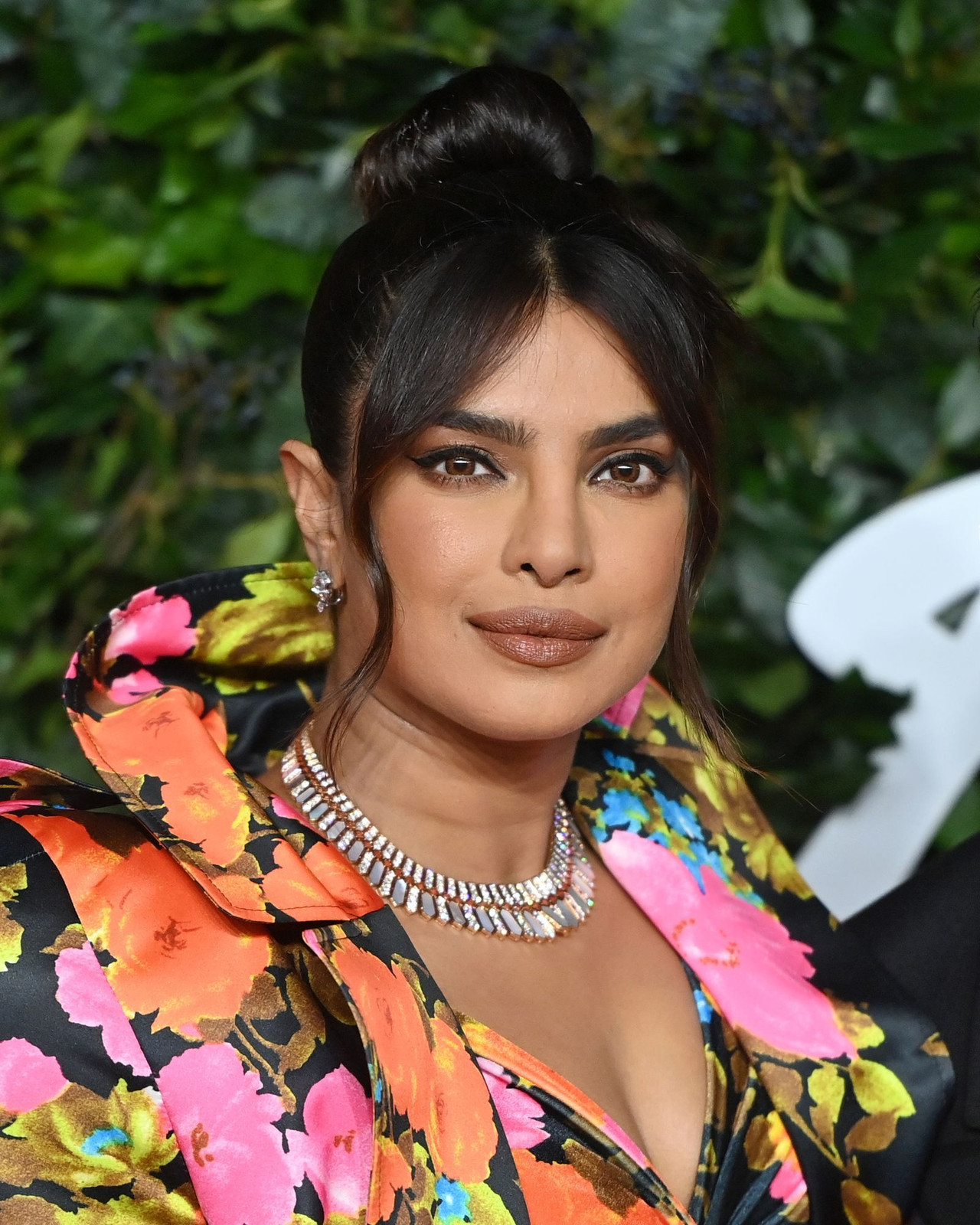 Thick Dark Brown Low Bun with Defined Bangs Thick Dark Brown Low Bun with Defined Bangs — Low Bun with Curtain Bangs