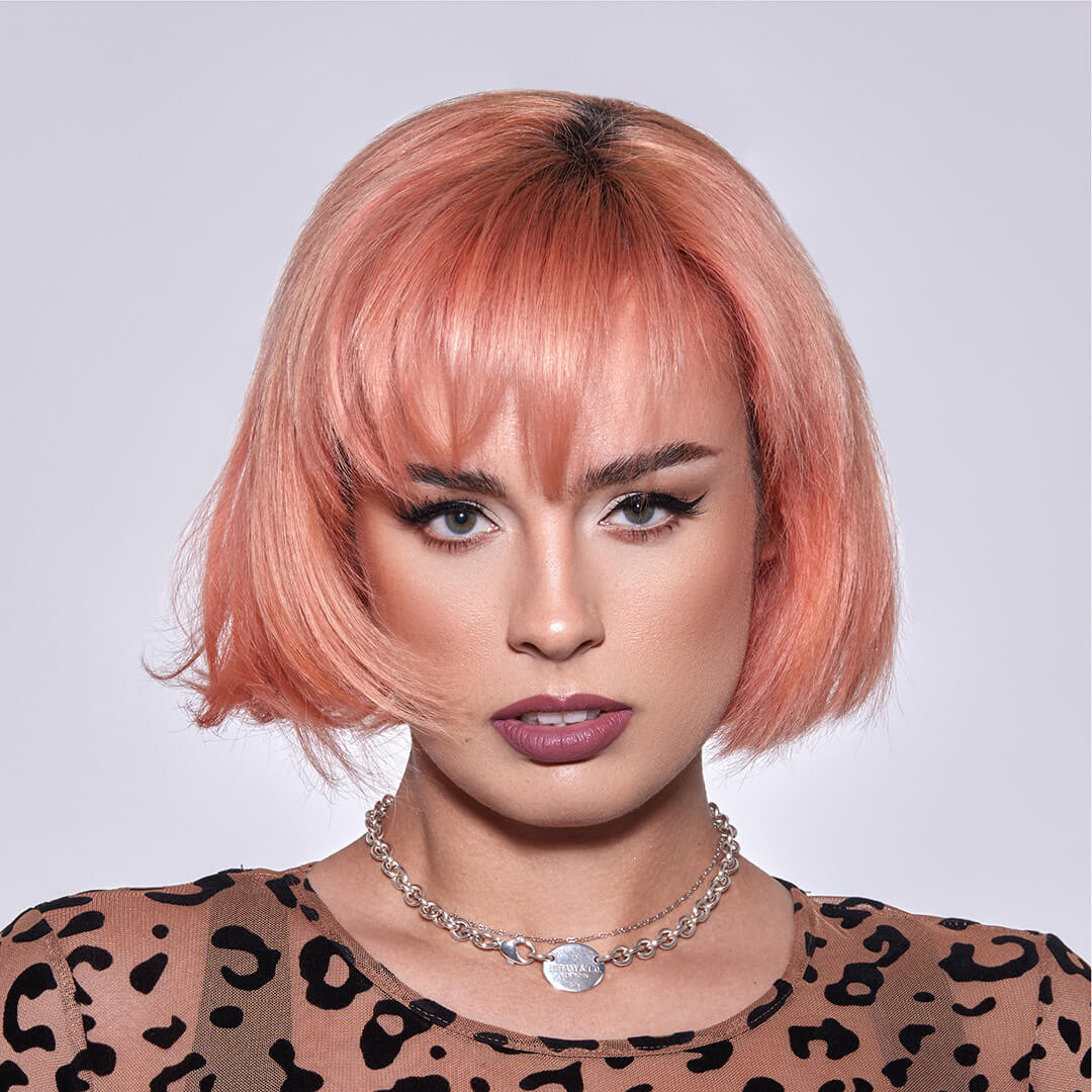 Sharp Chin Bob With Blunt Bangs Sharp Chin Bob With Blunt Bangs — Peach Hair