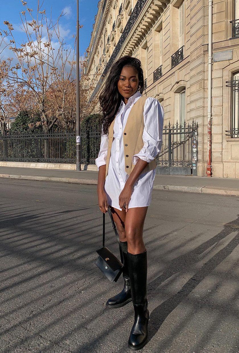 Oversized White Shirt Dress with Beige Vest and Black Boots — Shirt Dress Outfits