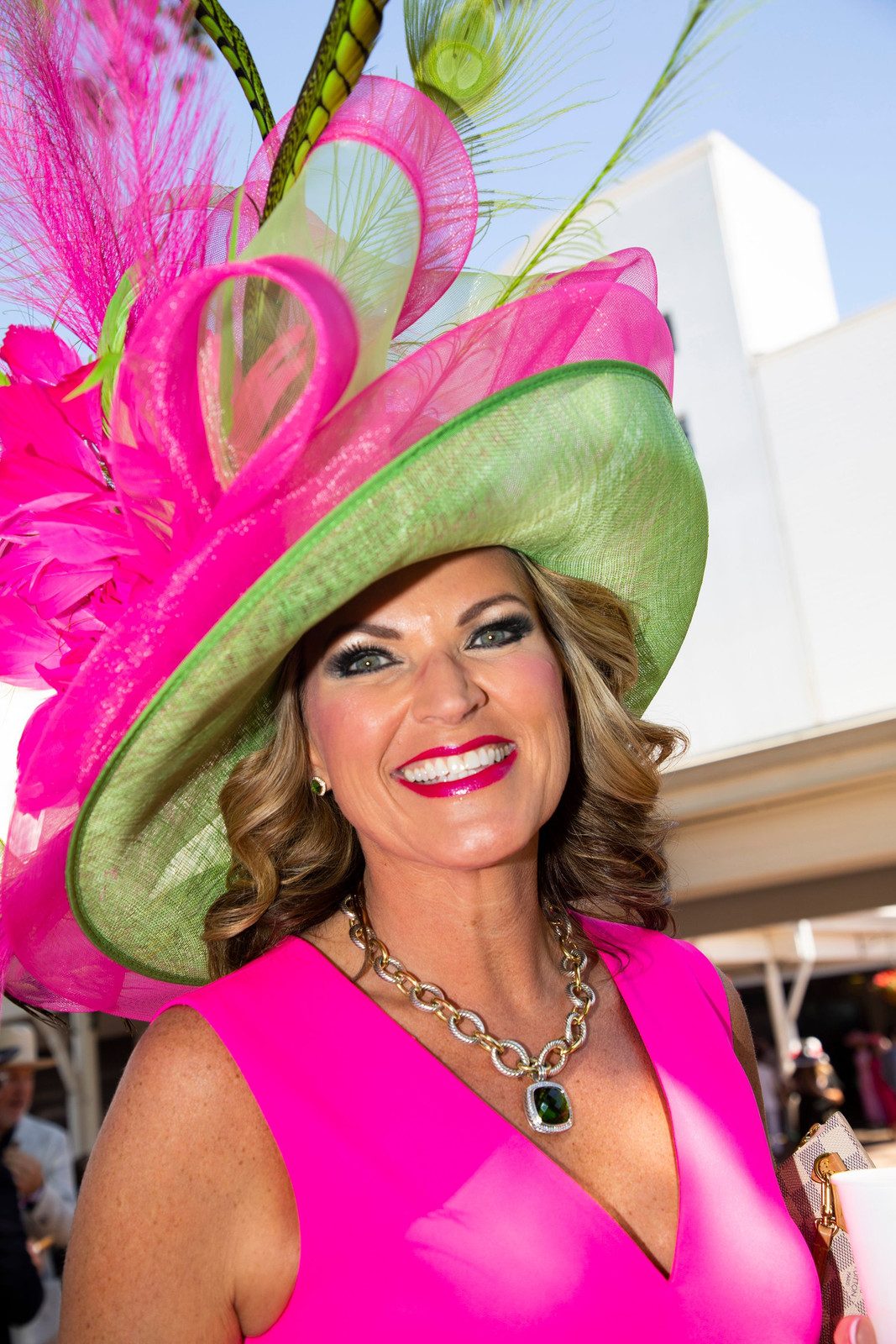 Hot Pink Sleeveless Dress with Elaborate Feathered Hat — Kentucky Derby Outfits