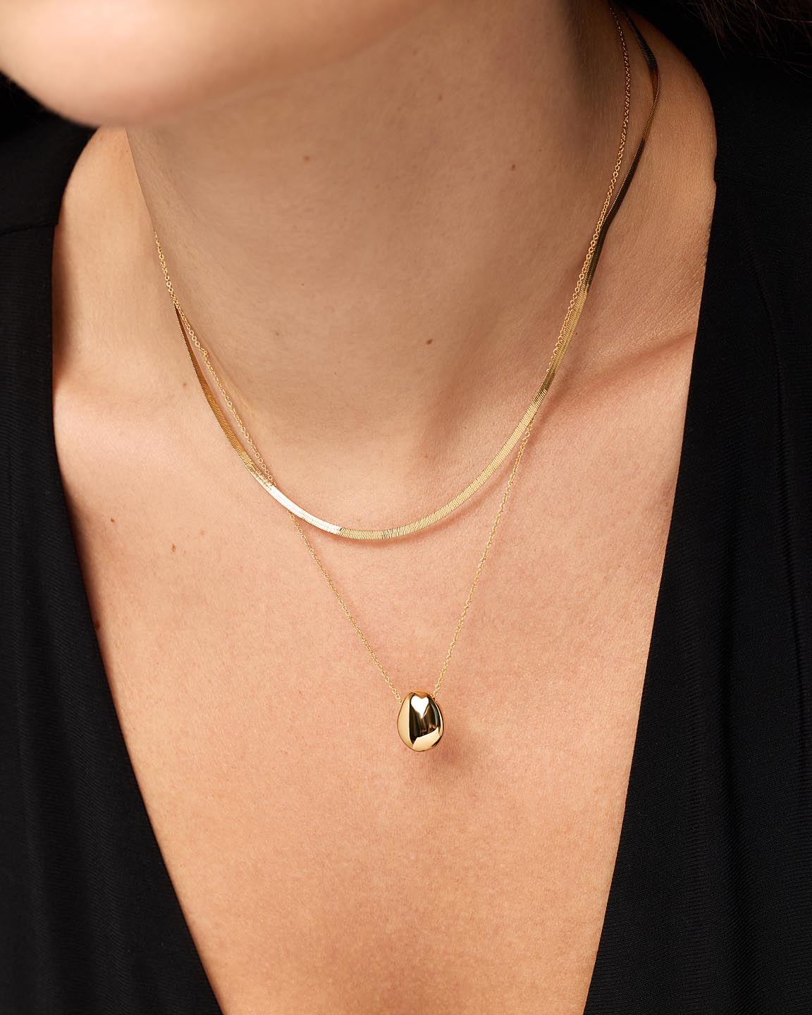 Everyday Evening Layered Gold Necklaces with Smooth Pendant on Black Top Everyday Evening Layered Gold Necklaces with Smooth Pendant on Black Top — Gold Jewelry