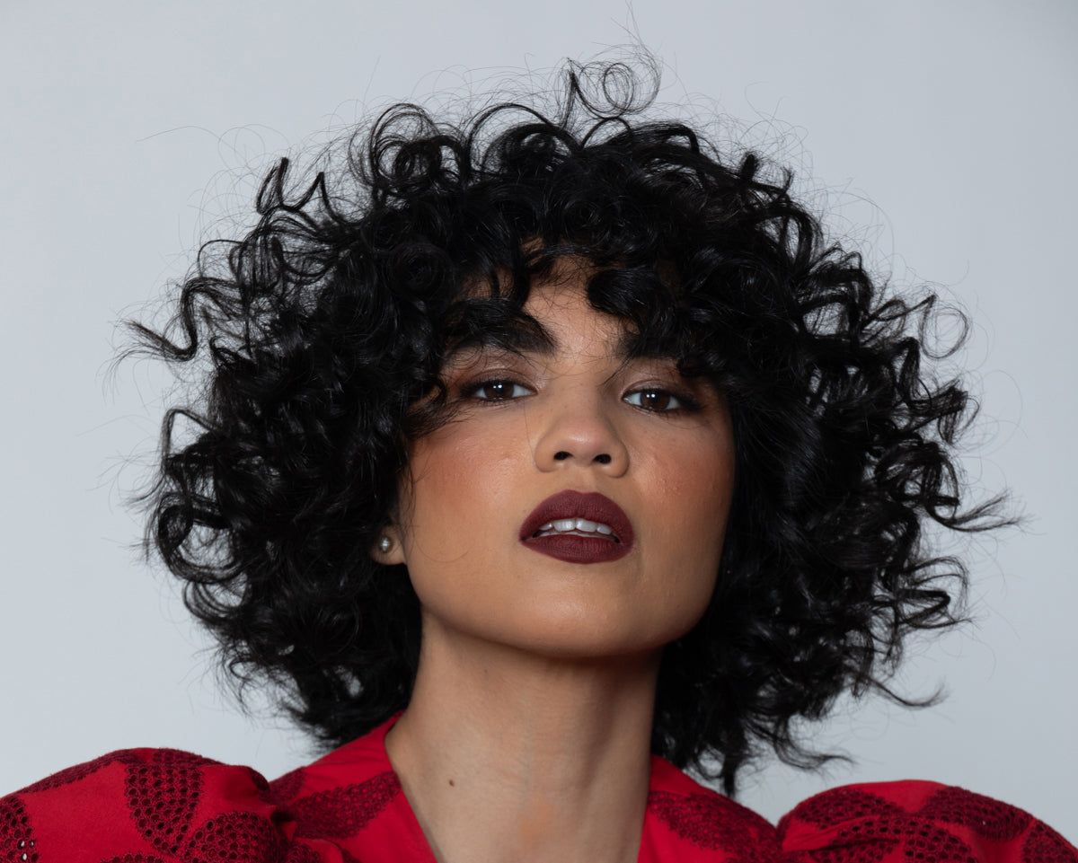 Black Bob With Defined Voluminous Curls Black Bob With Defined Voluminous Curls — Perms for Short Hair