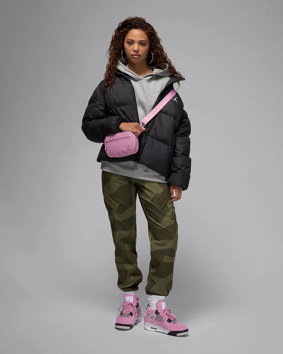 Playful Pop: Pink Jordan 4s with Cargo Pants and Puffer Jacket Playful Pop: Pink Jordan 4s with Cargo Pants and Puffer Jacket — Jordan 4 Outfits