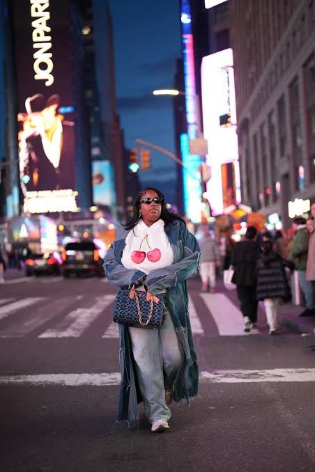 Denim Duster Coat and Graphic Tee Street Style Denim Duster Coat and Graphic Tee Street Style — Coach Bag Outfits