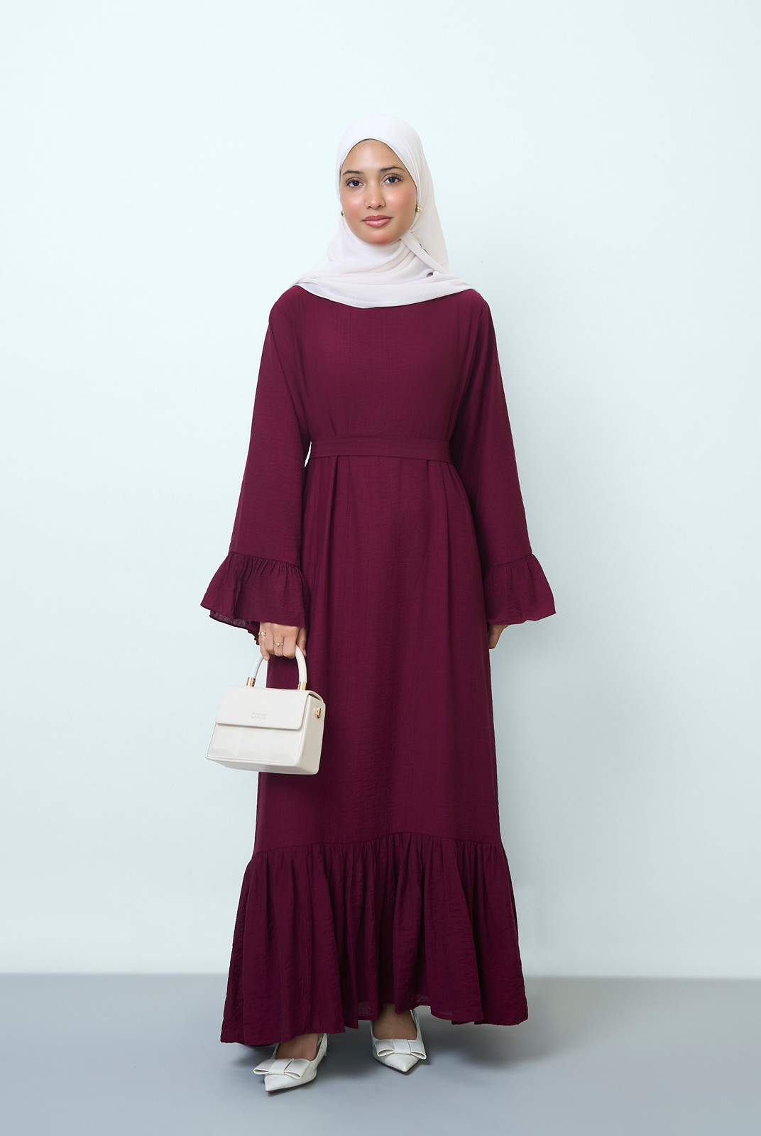 Burgundy Maxi Dress with Ruffled Cuffs and Tiered Hem Burgundy Maxi Dress with Ruffled Cuffs and Tiered Hem — Hijab Wedding Guest Outfits