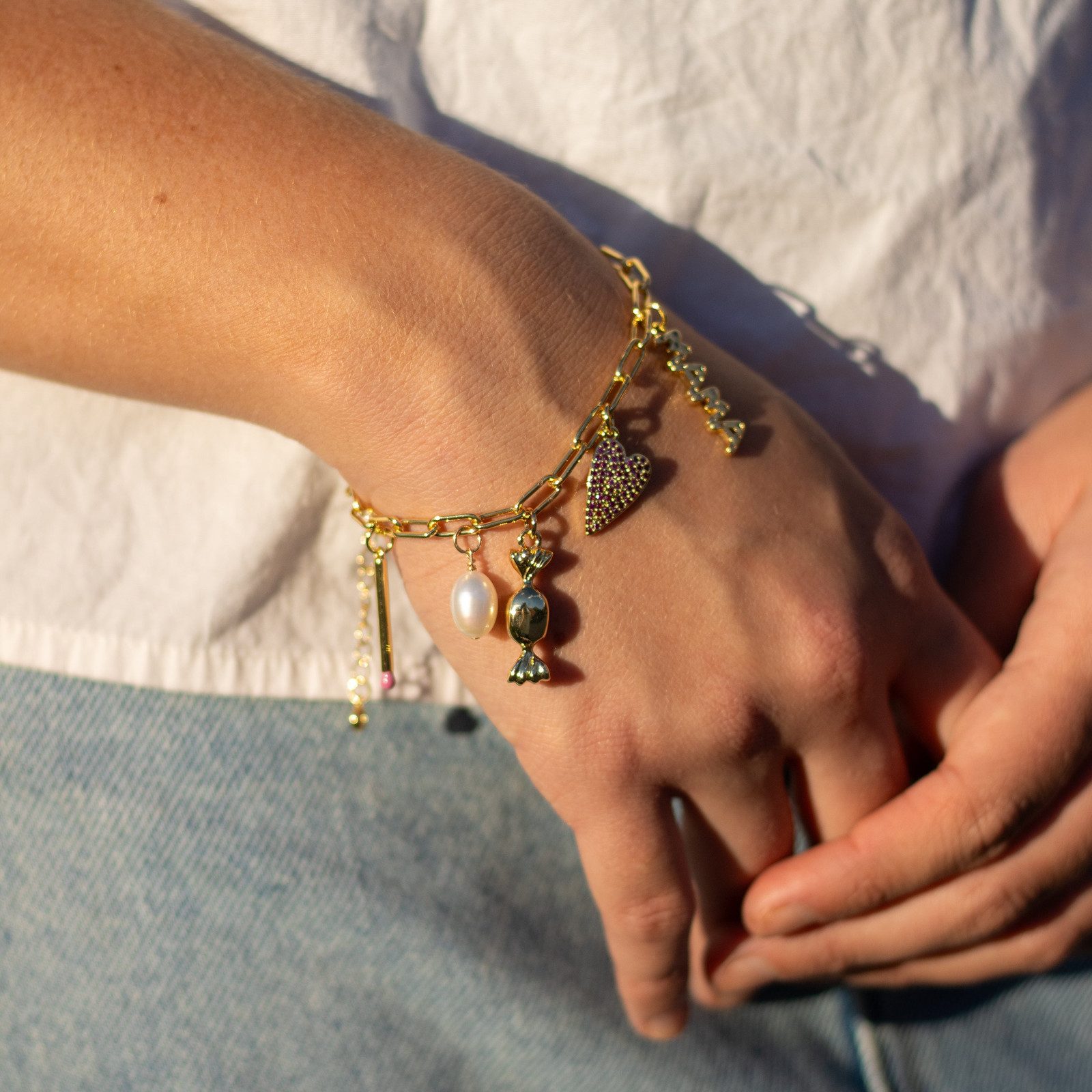 Whimsical Charms on a Casual White Shirt and Denim Look Whimsical Charms on a Casual White Shirt and Denim Look — Charm Bracelets