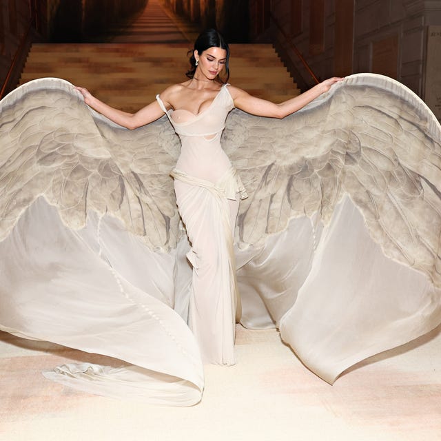 Ethereal Off-White Draped Gown with Wing-Like Train — Gala Outfits