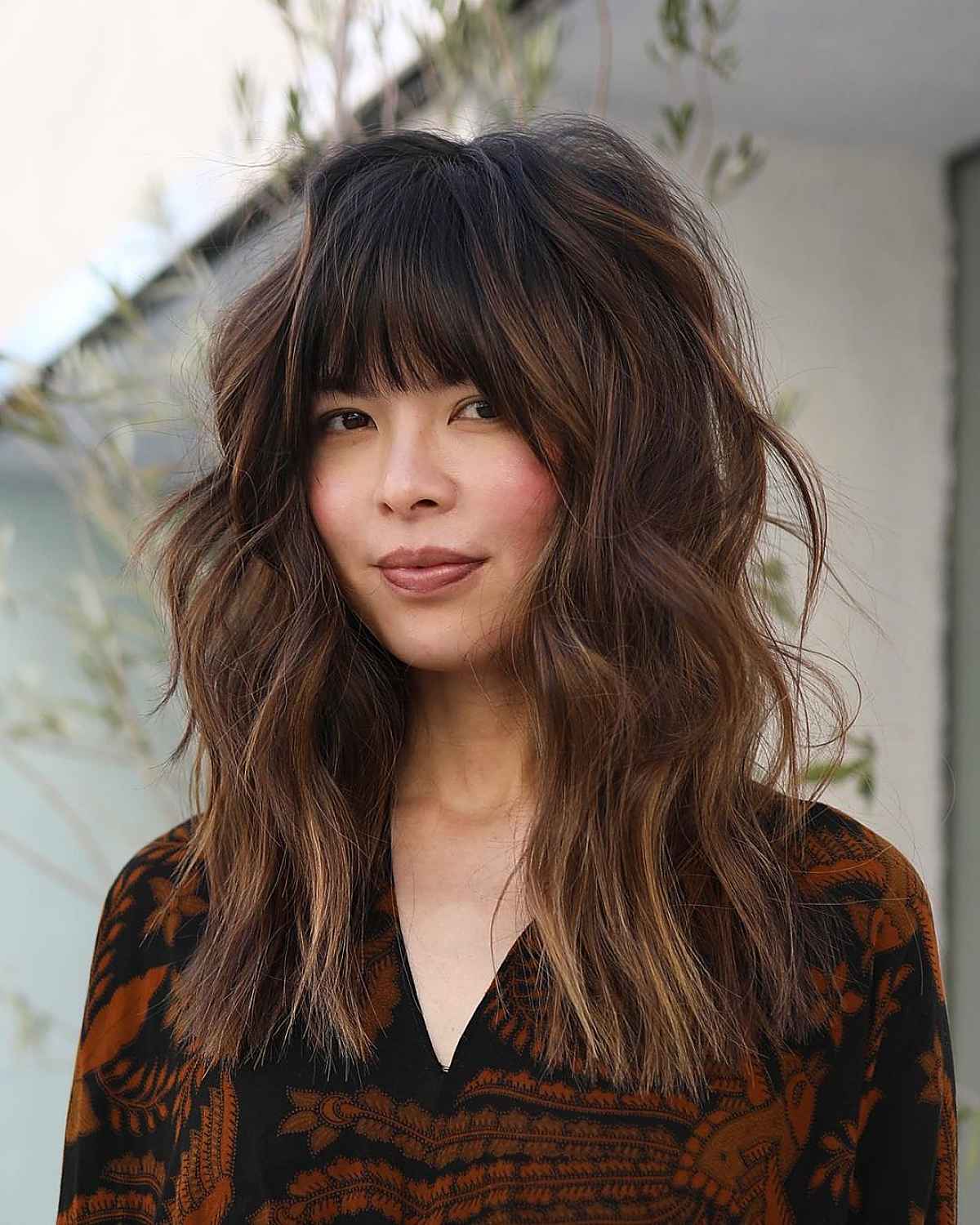Pattern Play: Layered Dark Hair with Bangs and a V-Neck Top — Bangs with Layers