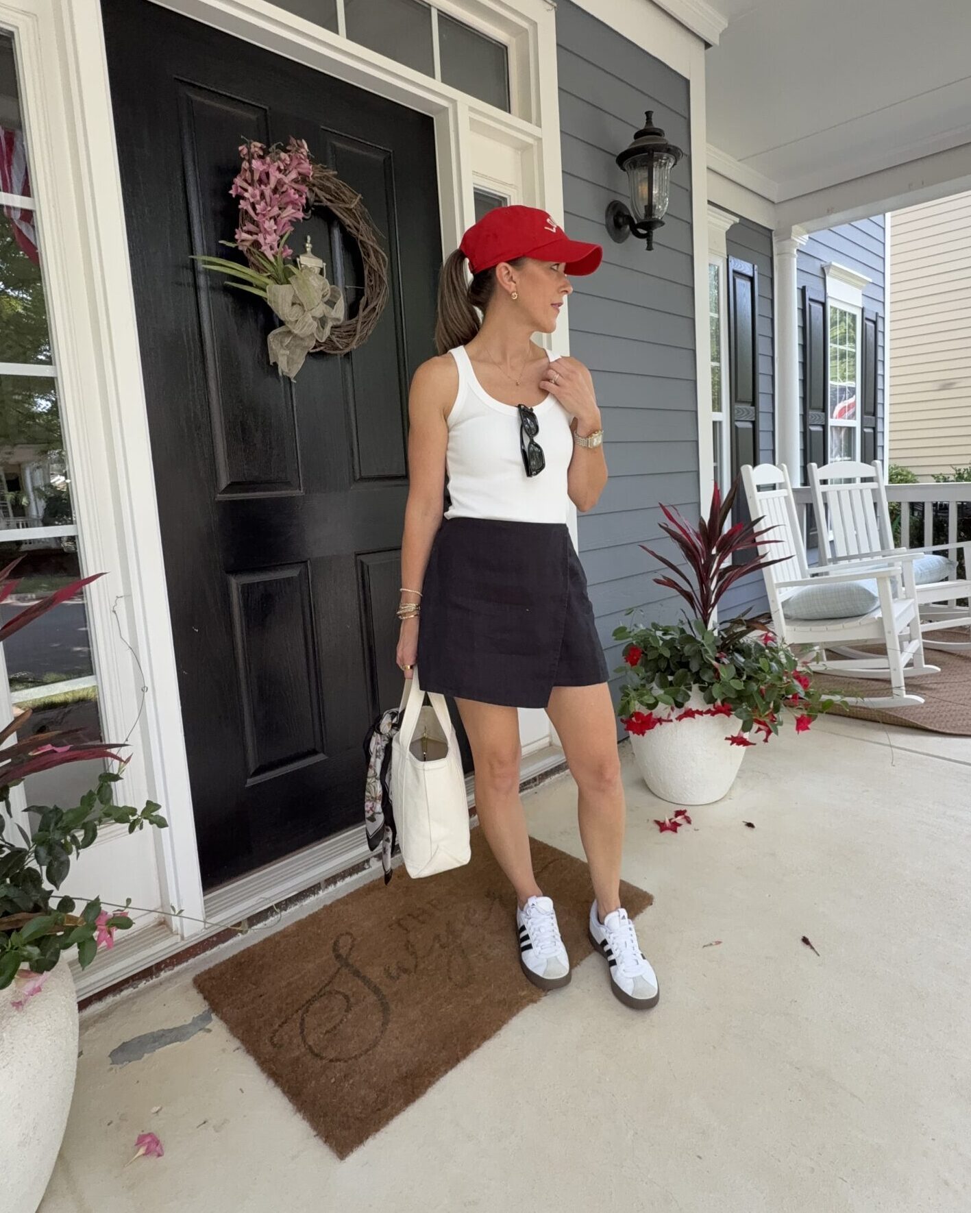 White Tank Top with Black Wrap Skirt and Red Cap for a Casual Summer Day — Tank Top Outfits