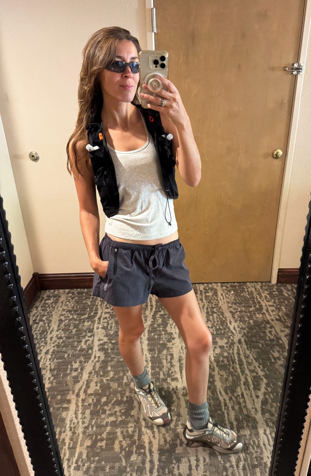 Trail Running Ready: White Tank, Black Vest, and Grey Shorts Trail Running Ready: White Tank, Black Vest, and Grey Shorts — Yosemite Outfits