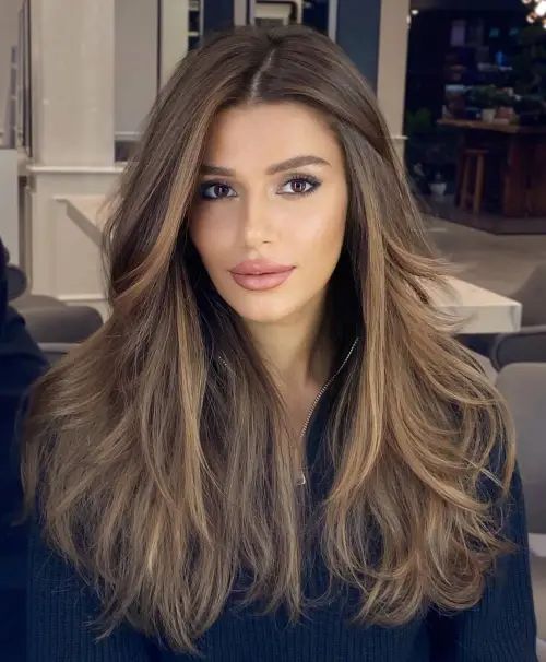 Thick Wavy Dark Brown with Curtain Bangs — Hairstyles for Long Faces